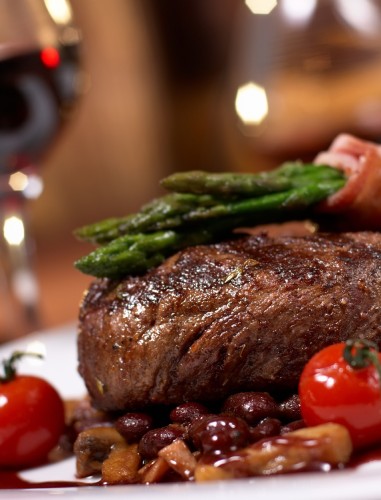 HOME - close up van een vleesgerecht